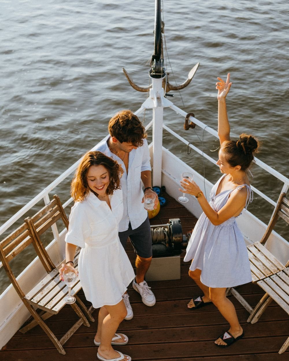 Friends celebrating on a boat deck