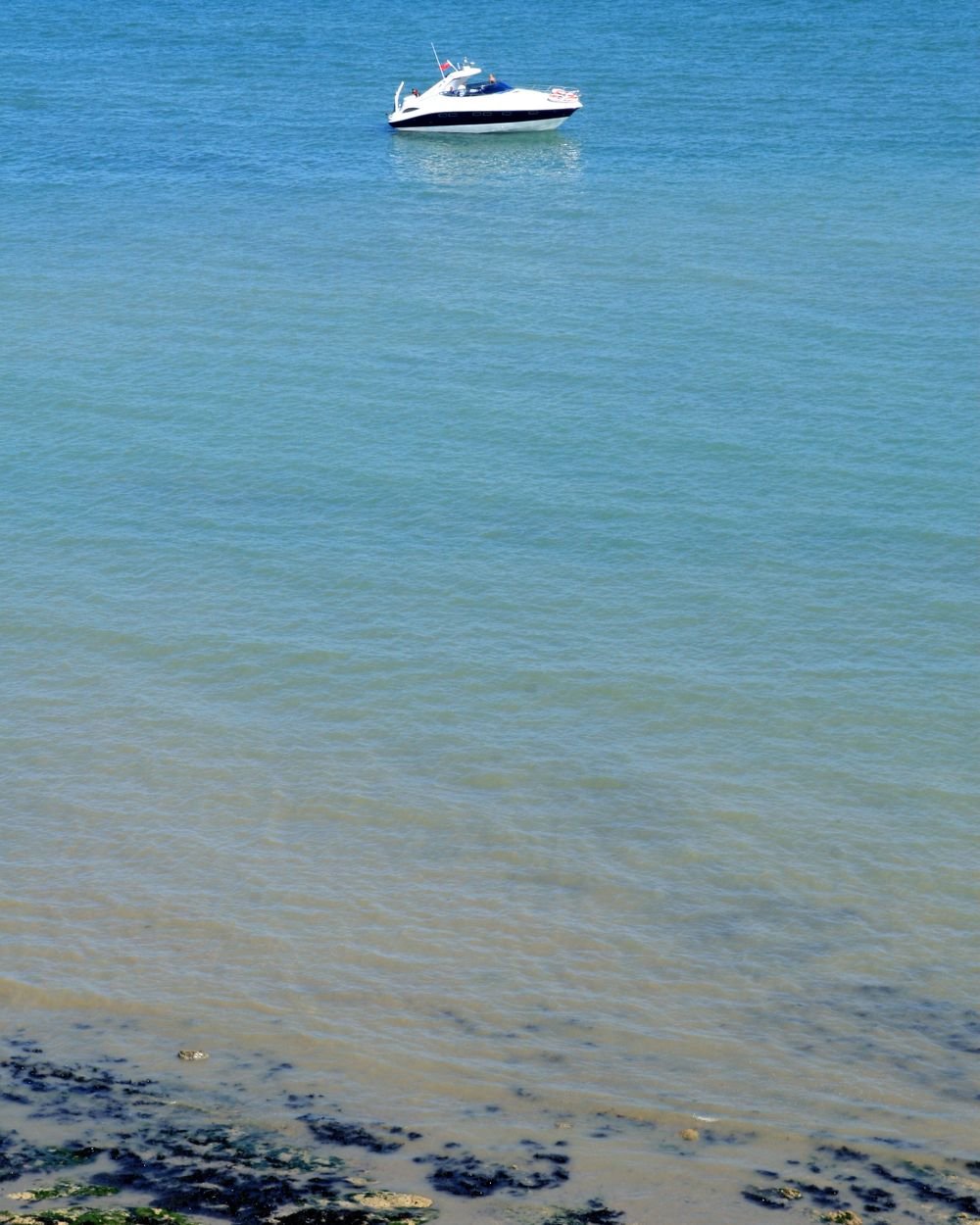Small open boat in a shallow bay