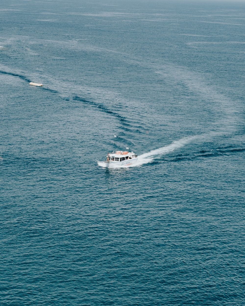 Speedboat carving a turn on open water