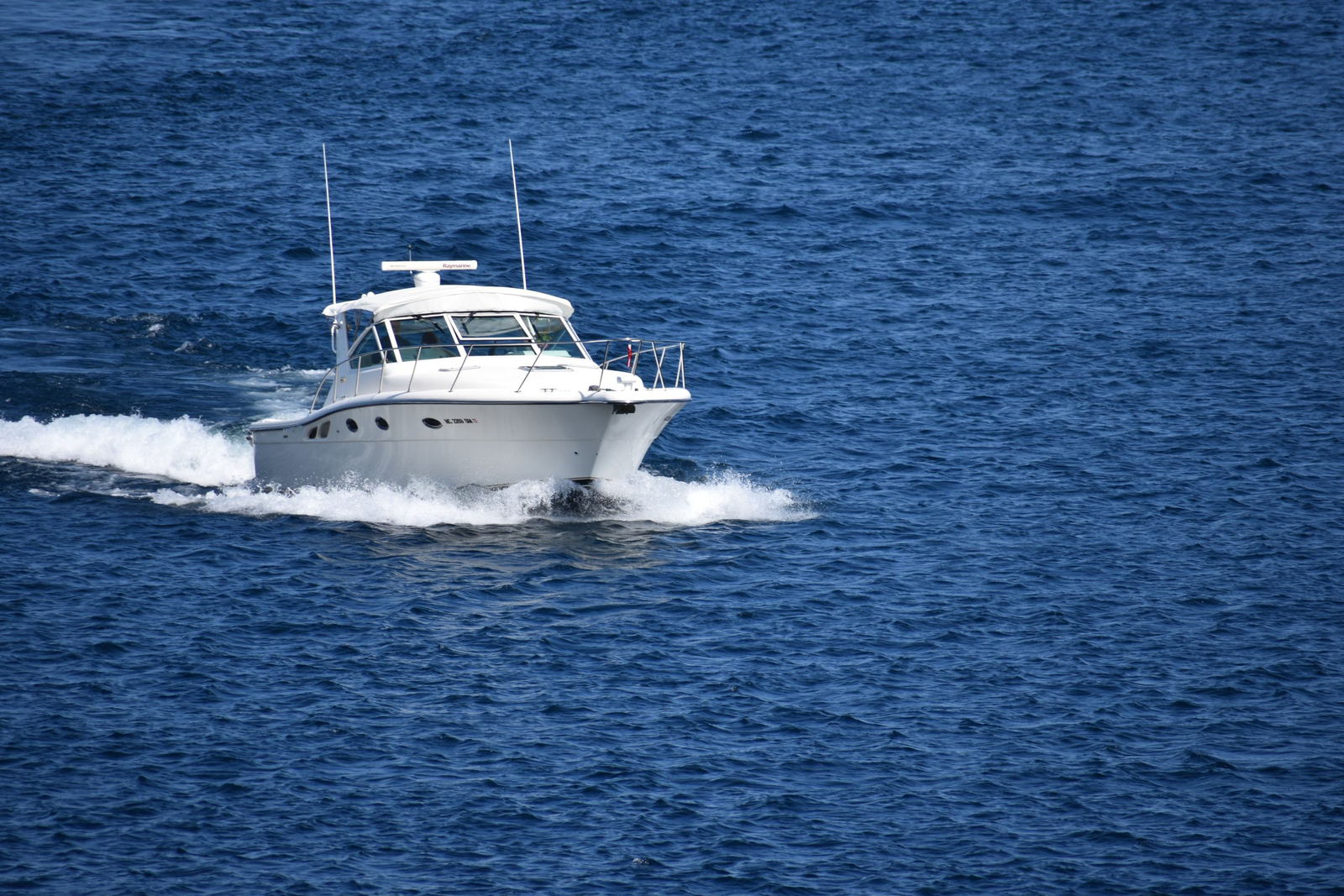 A powerboat cruising on deep blue water