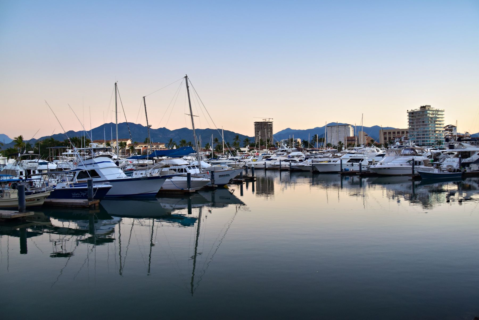 Yachts reflected in Puerto Vallarta harbour at sunset