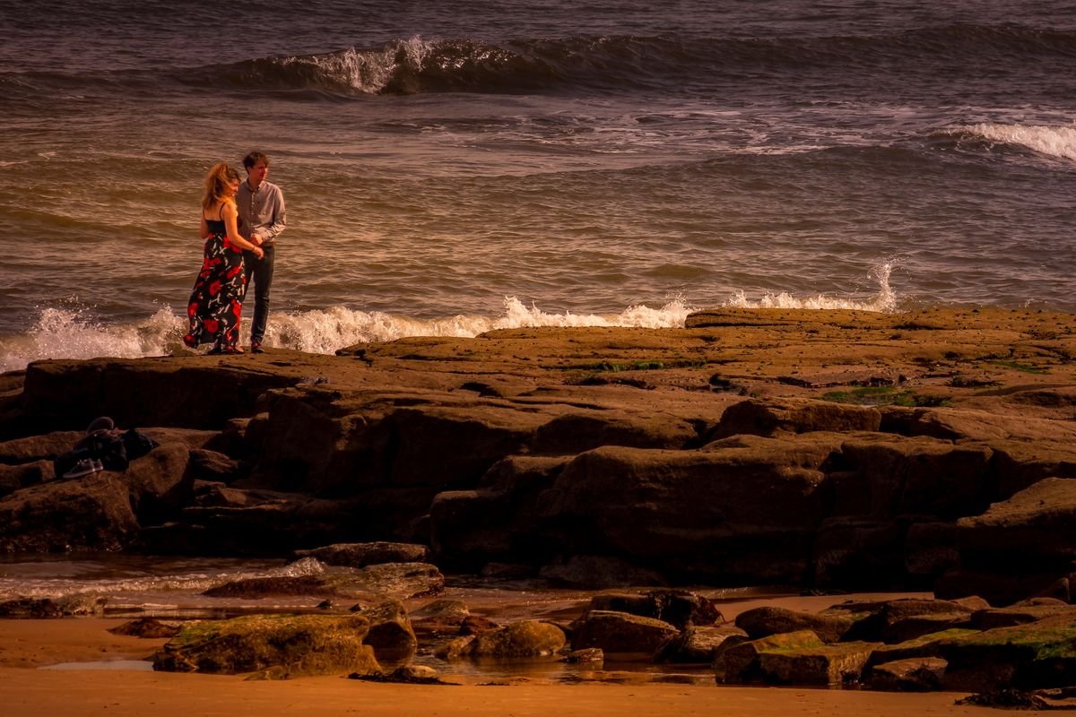 Couple on a bow at dusk