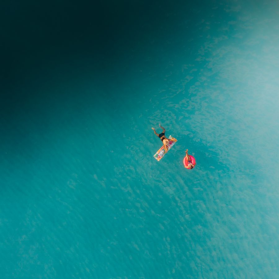 Swimmers in turquoise water