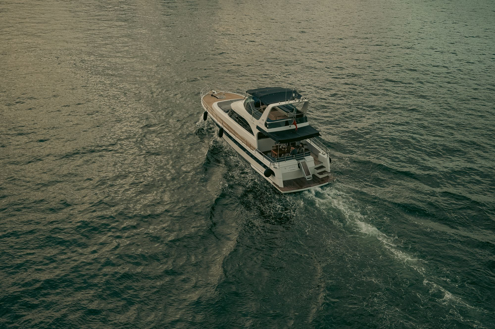 Luxury yacht anchored off the Mexican coast, turquoise water