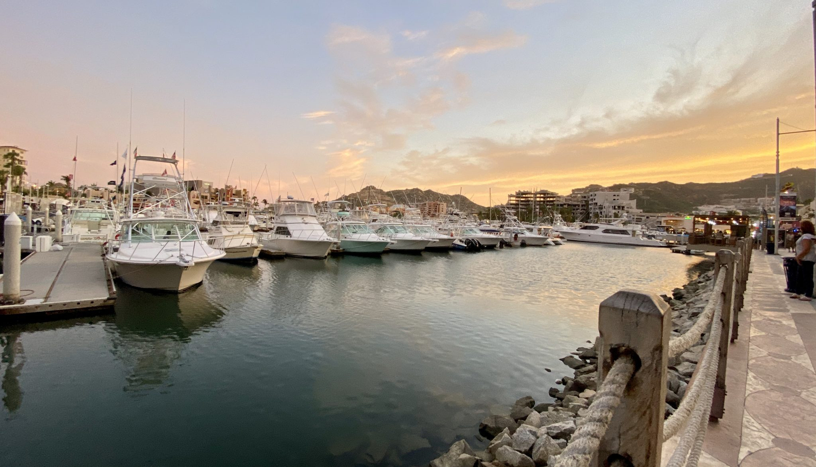 Boats moored in the Cabo San Lucas marina as the sun goes down