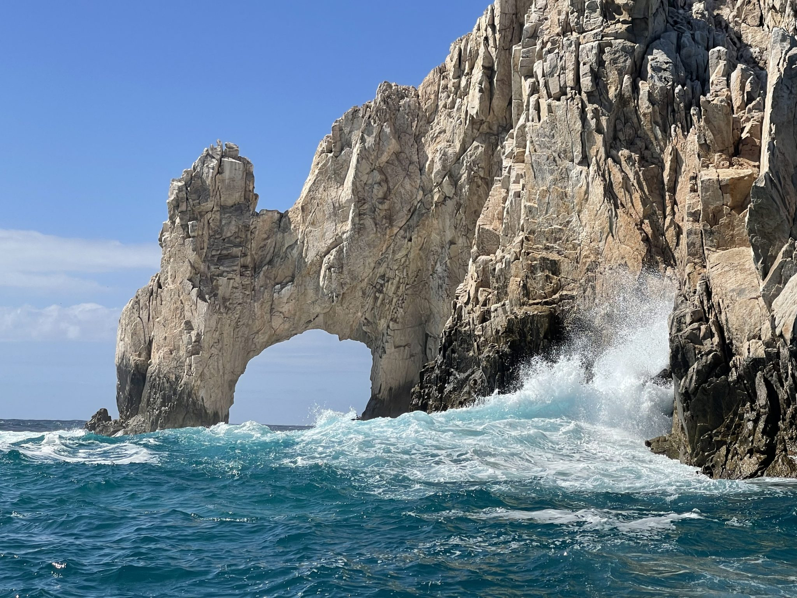 Waves breaking against El Arco, the rock arch at the tip of Cabo San Lucas