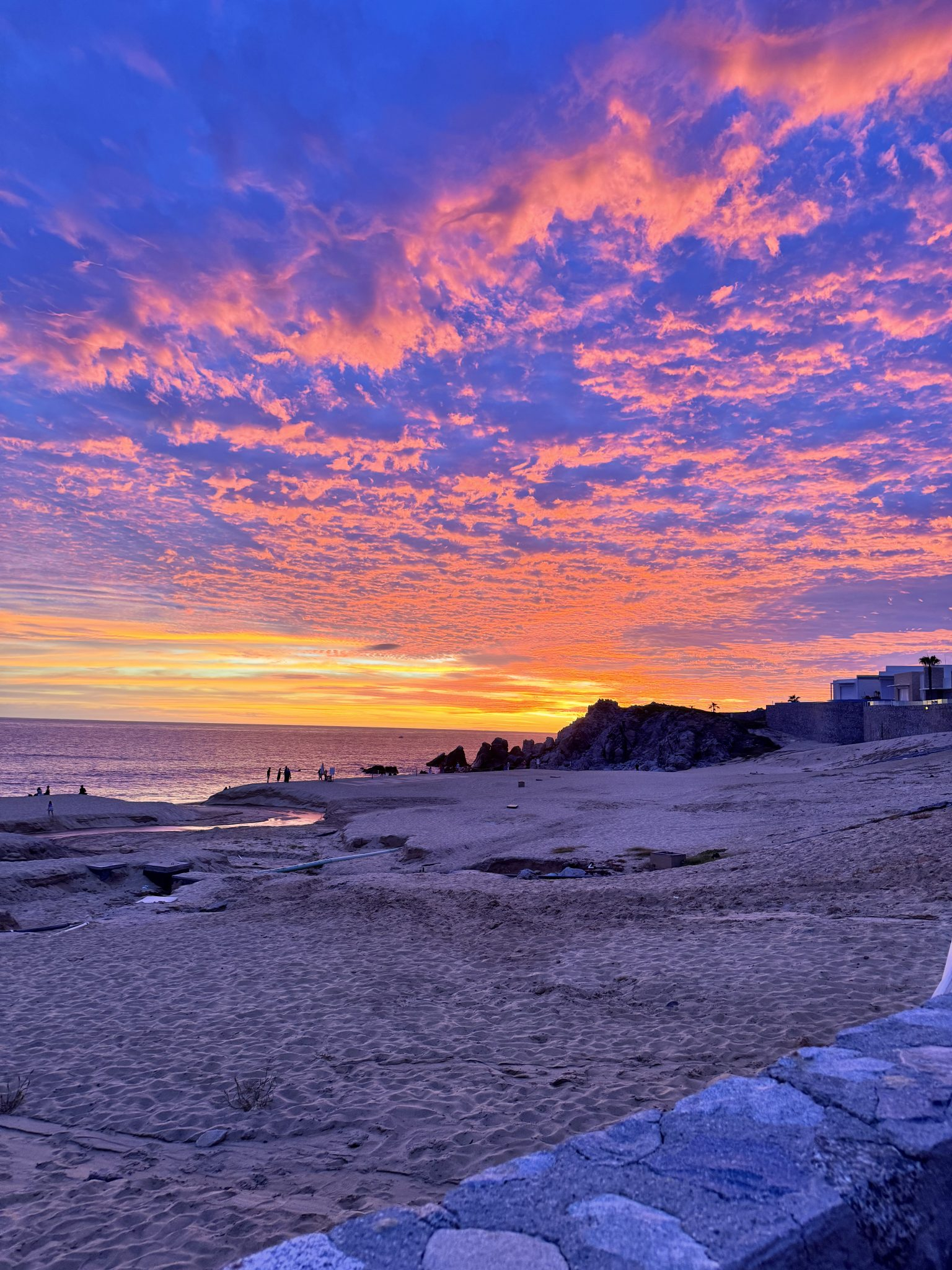 Pink and purple sunset over the coast at Los Cabos