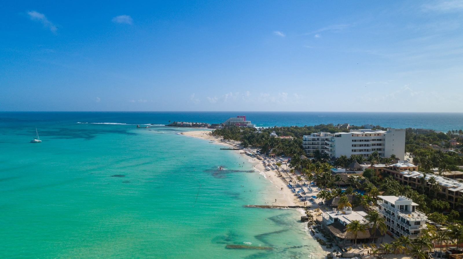 Turquoise shallow water and clean white sand along Playa Norte on Isla Mujeres